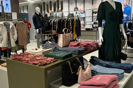 Retail store interior with display tables and shelving fitted by Nova Bespoke